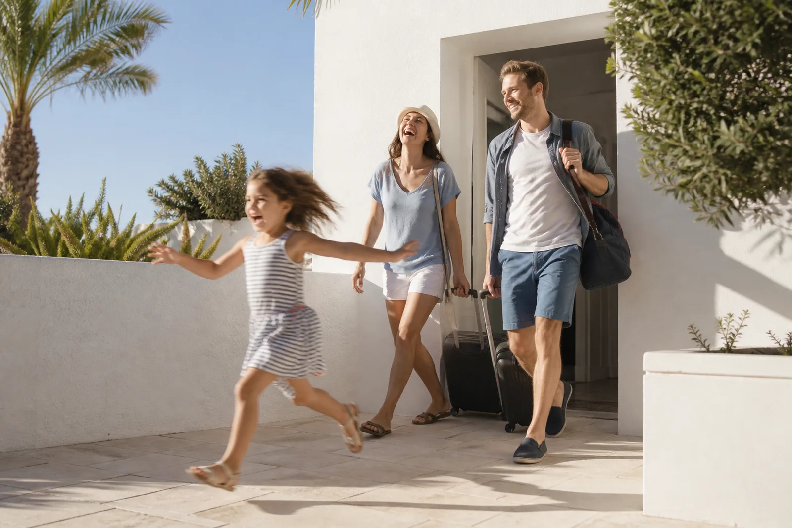 A family leaving the house with bags in hard morning daylight